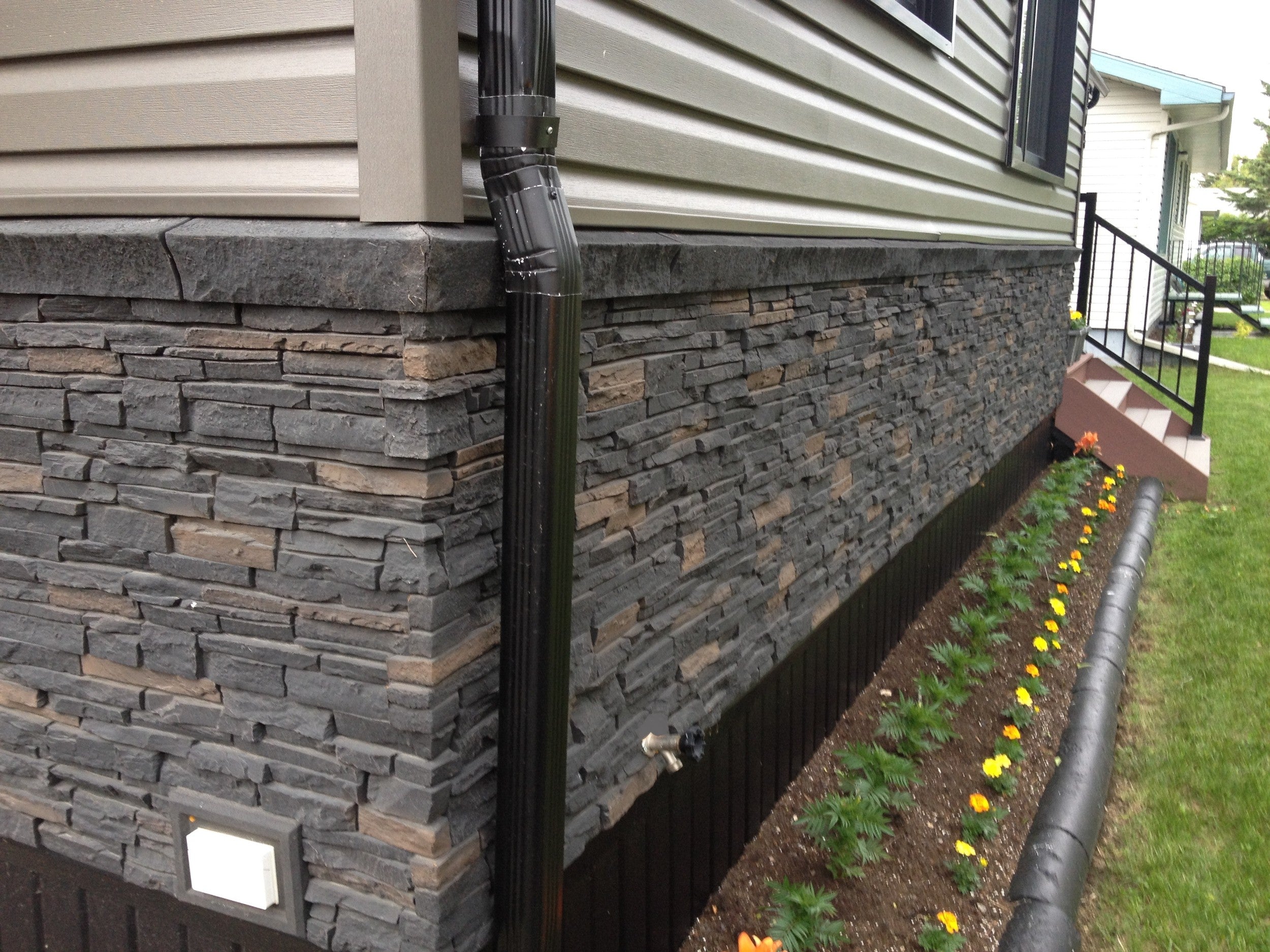 Quality Stone faux Stacked Stone panel in Dark Brown Blend — interlocking polyurethane wall panel, 2 sq ft per piece