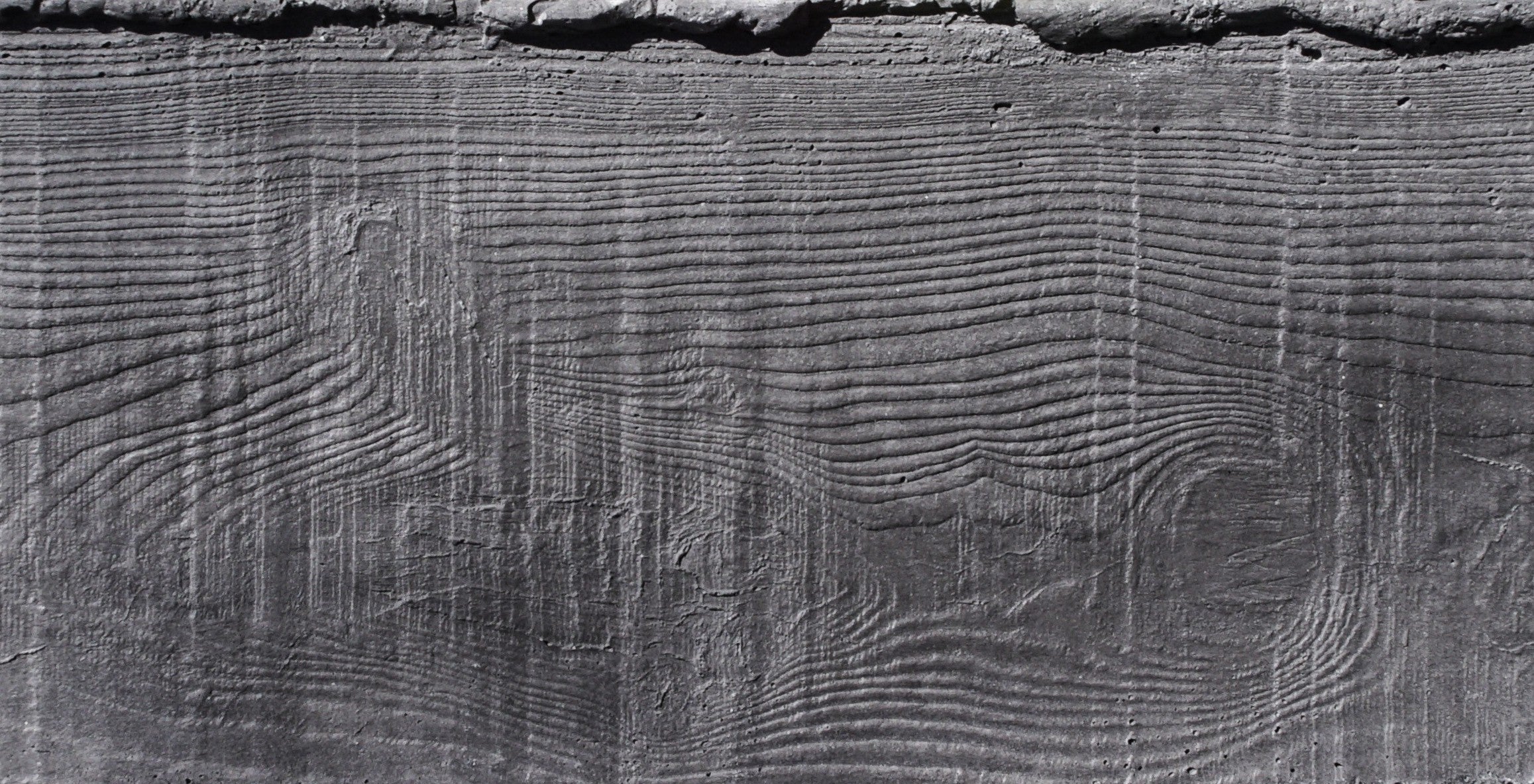 RealCast Board-Form Concrete Wall Panel in Charcoal — fiber-reinforced concrete plank, 3.33 sq ft per piece