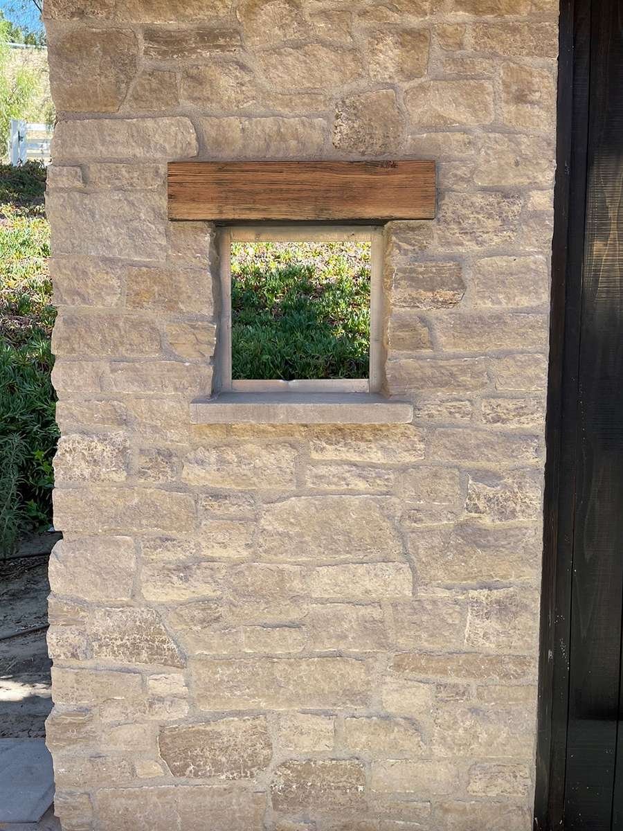 Ashford Gray Limestone Random Heights installed stone wall