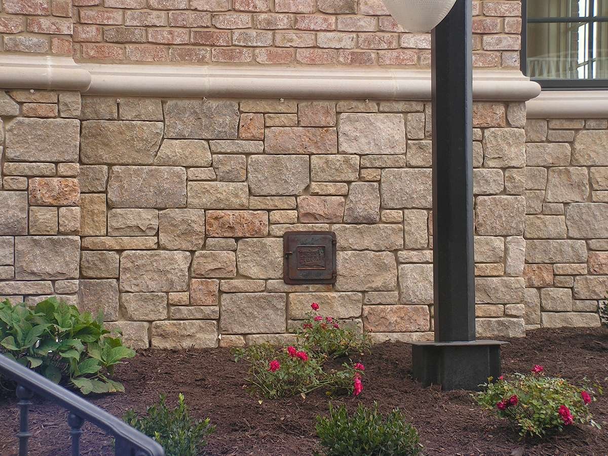 Hartwell Gold Limestone Tumbled Dimensional installed stone wall