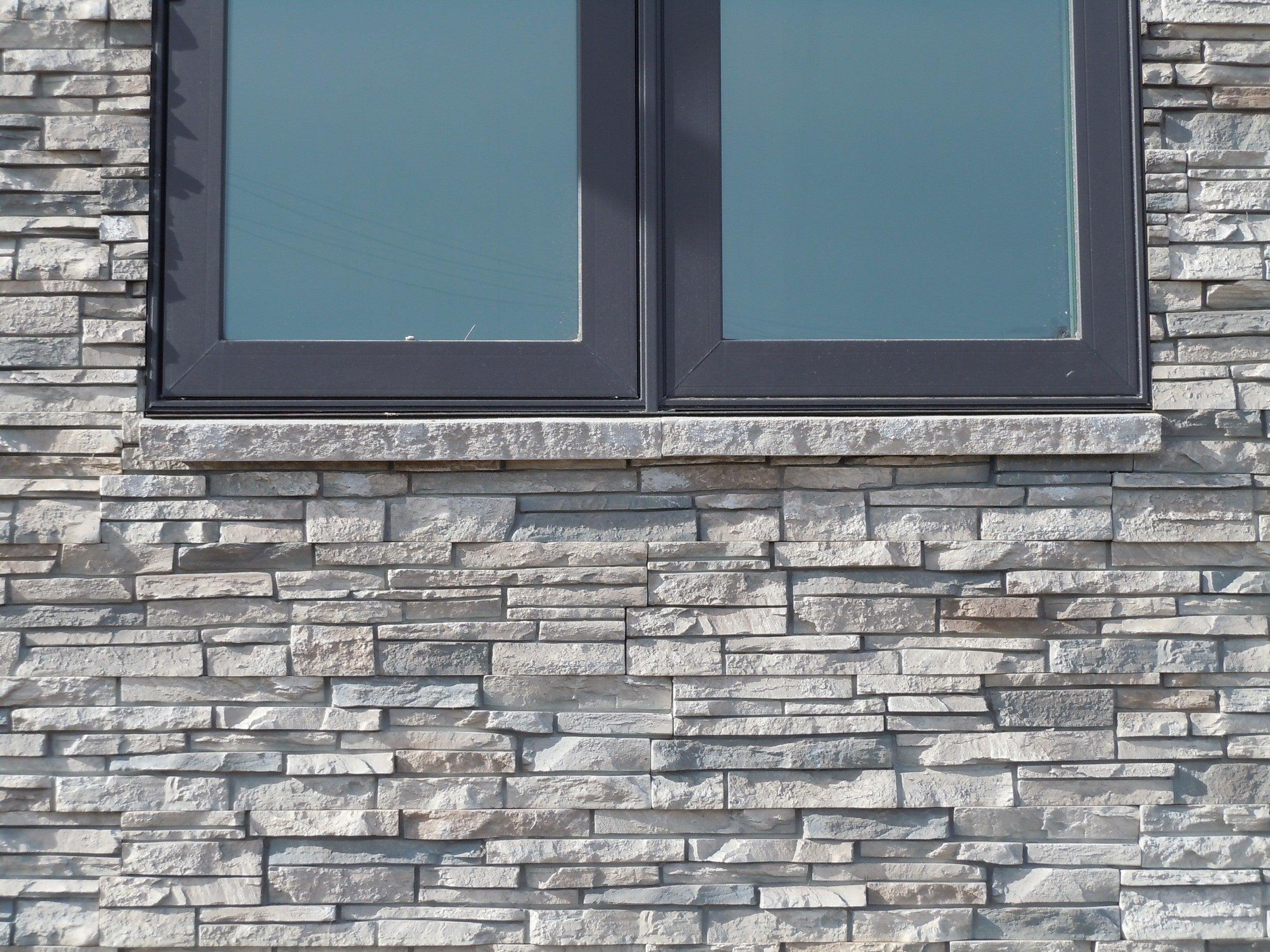 Quality Stone faux Stacked Stone panel in Limestone — interlocking polyurethane wall panel, 2 sq ft per piece
